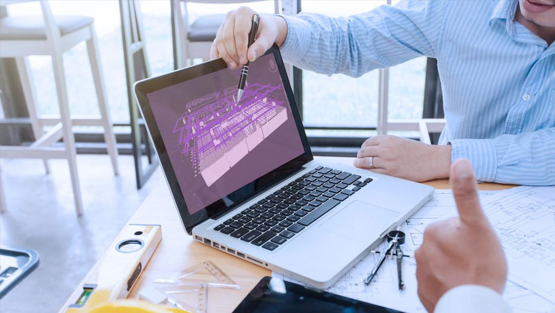 Ein Laptop, dessen Bildschirm eine BIM-Darstellung von Kabeltragsystemen zeigt